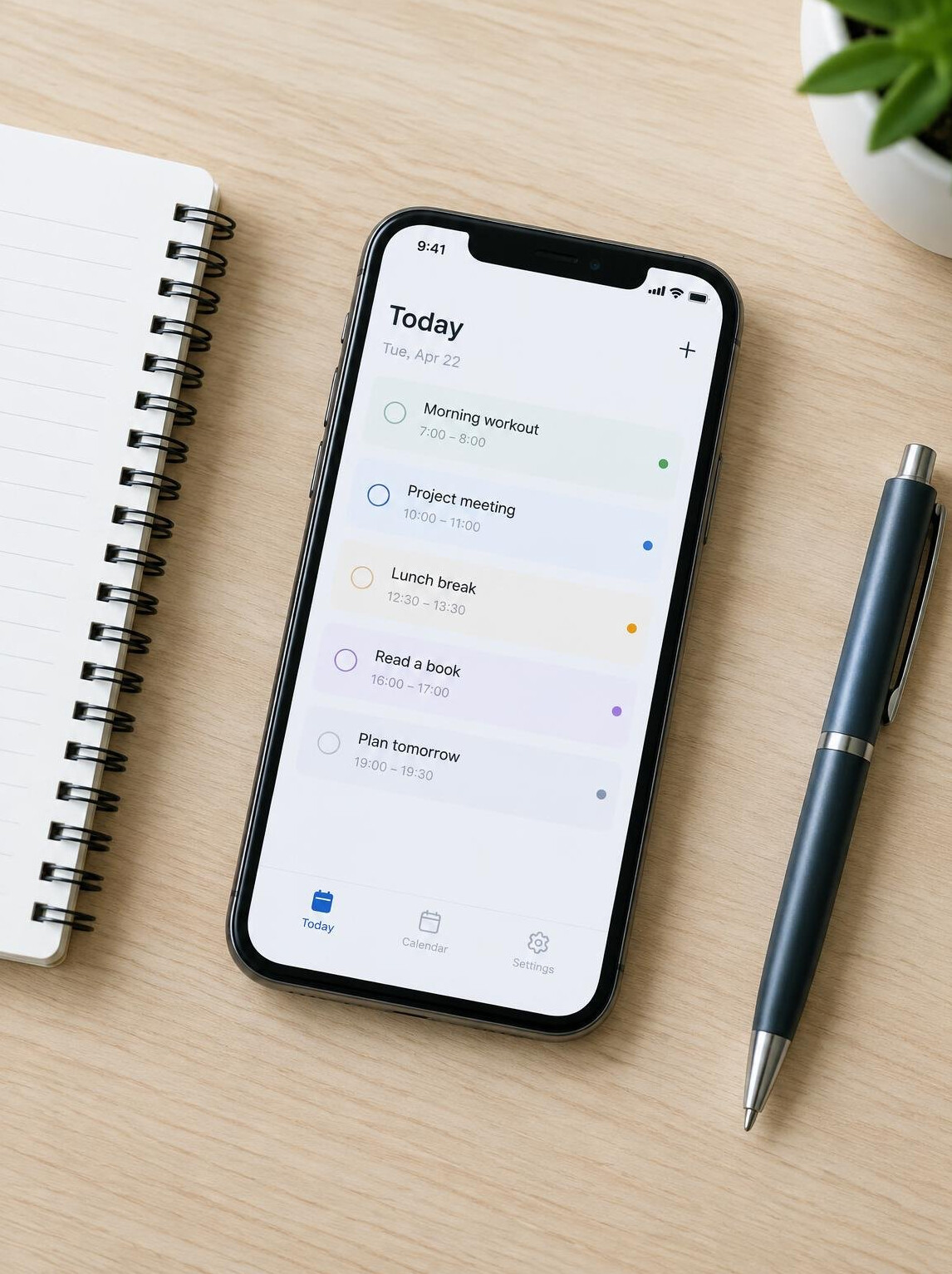 Smartphone with a planning app on a desk